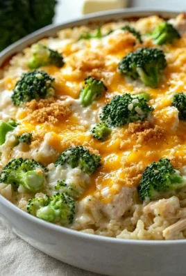 Cheesy broccoli chicken casserole with rice and melted cheese