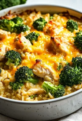 Cheesy broccoli chicken casserole with rice in a baking dish
