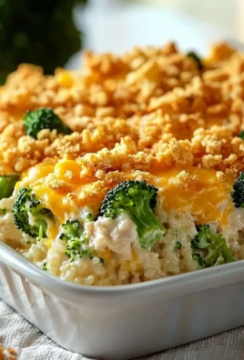Cheesy chicken broccoli rice casserole served in a baking dish