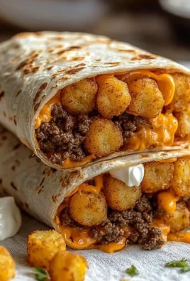 Cheesy potato burritos wrapped in tortillas, ready to serve.
