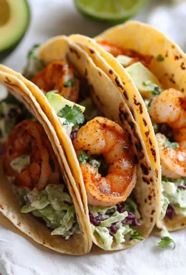 Cilantro lime shrimp tacos served with creamy slaw on a plate