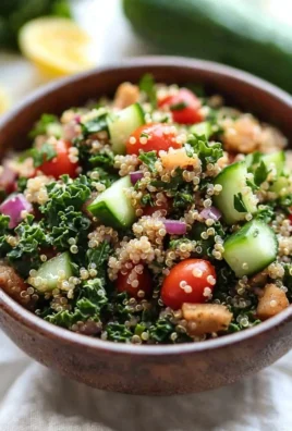 Easy detox quinoa salad with fresh vegetables and herbs for a healthy meal.