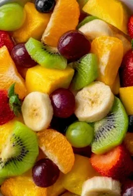 Colorful bowl of fresh fruit salad with a variety of fruits