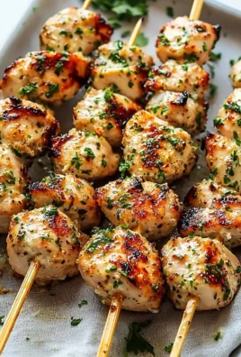 Garlic-Parmesan Chicken skewers grilled to perfection.