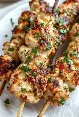Delicious Garlic Parmesan Chicken Skewers on a grill plate
