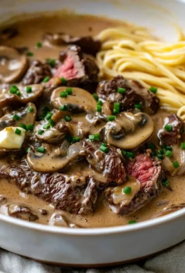 Gordon Ramsay's Beef Stroganoff served with pasta and garnished with parsley