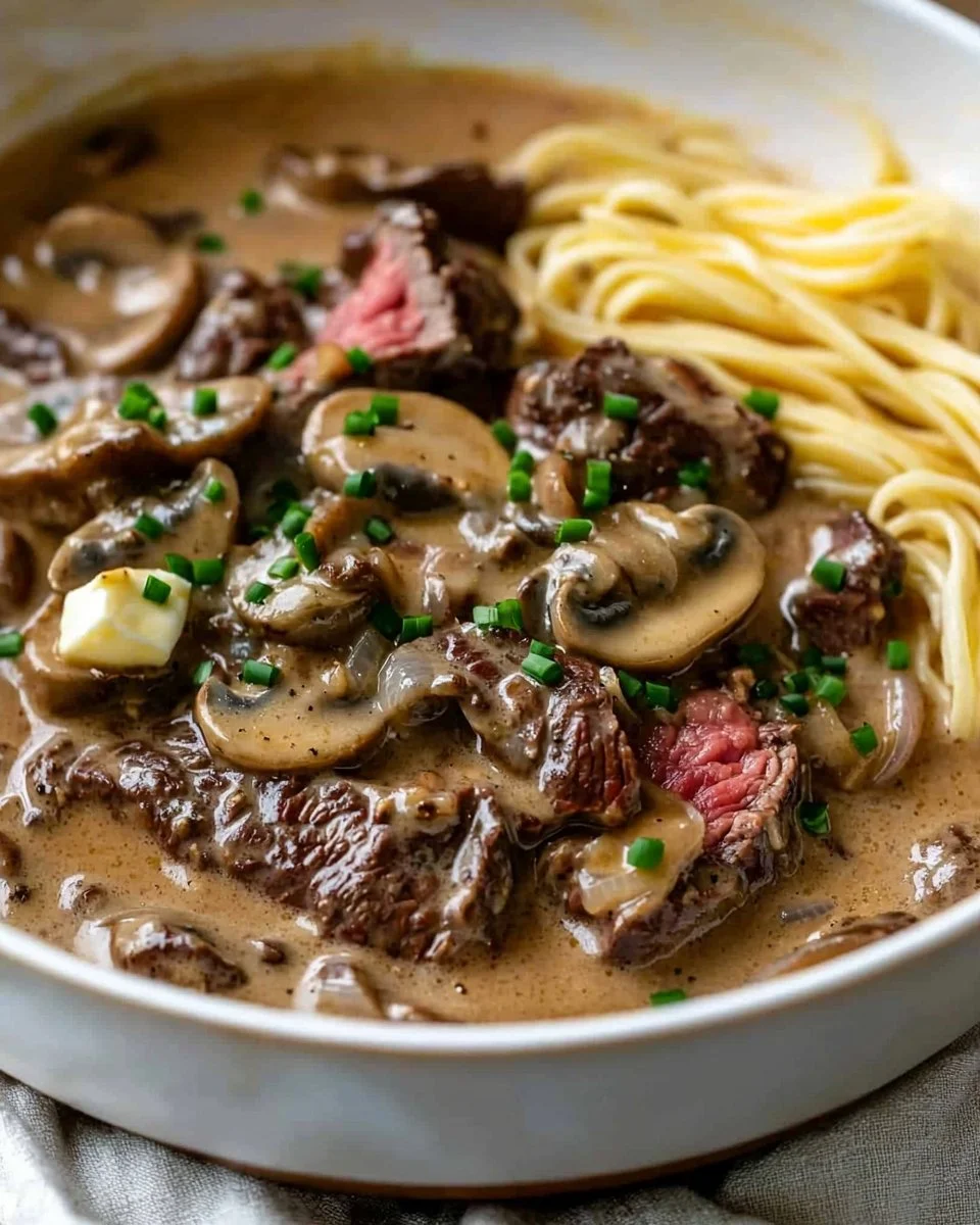 Gordon Ramsay's Beef Stroganoff served with pasta and garnished with parsley