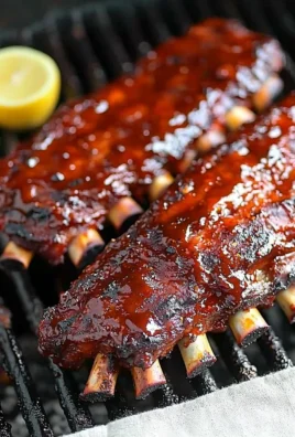 Succulent grilled ribs coated in a delicious BBQ sauce served on a plate