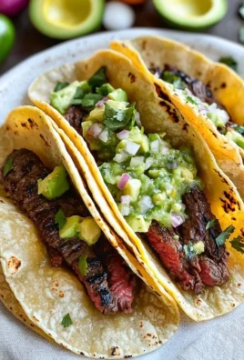 Grilled steak tacos with avocado salsa served on a plate
