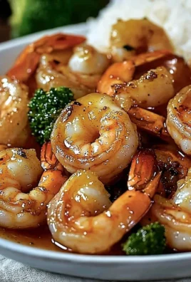 Delicious high-protein honey garlic shrimp served on a plate with vegetables