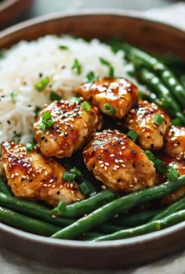 Delicious Honey Garlic Chicken with fresh green beans on a plate