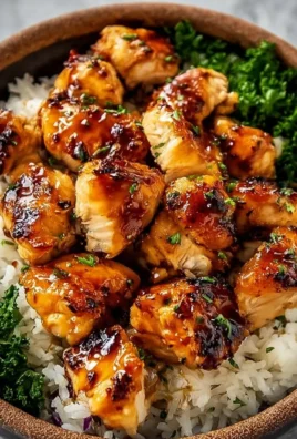 Delicious hot honey chicken bowls garnished with vegetables and sesame seeds