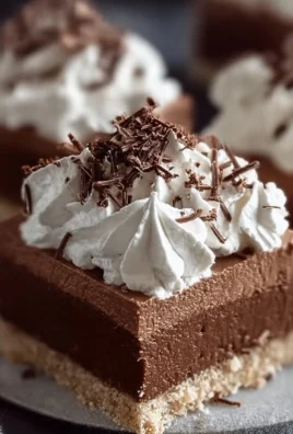 Delicious homemade French silk pie bars topped with chocolate and whipped cream