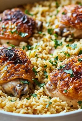 Oven-Baked Chicken served with rice on a plate, garnished and ready to eat