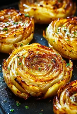 Roasted cabbage steaks served on a plate with seasoning