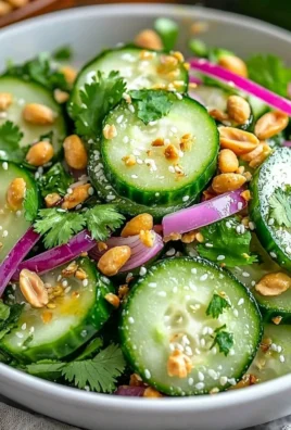 A vibrant bowl of Tasty Thai Cucumber Salad with fresh vegetables and herbs