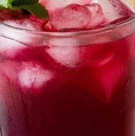 Refreshing glass of homemade blueberry lemonade with fresh blueberries