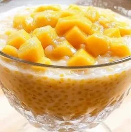 Delicious Mango Sago dessert in a bowl, perfect creamy summer treat.