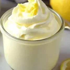 Delicious bowl of indulgent lemon mousse topped with lemon zest