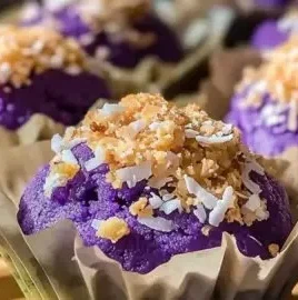 Freshly baked ube muffins showcasing vibrant purple color and texture.