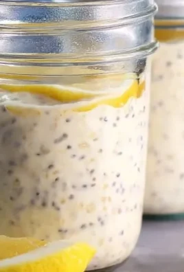 Delicious lemon cheesecake overnight oats topped with fresh lemon zest.