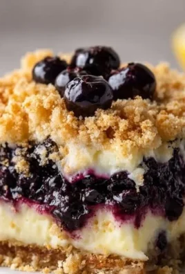 Delicious Lemon Cream Blueberry Crumble dessert with fresh blueberries and lemon cream