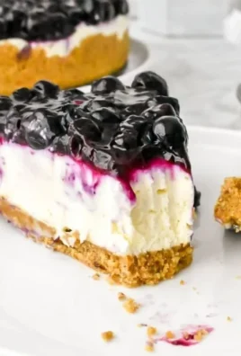 No bake blueberry cheesecake dessert with fresh blueberries on top