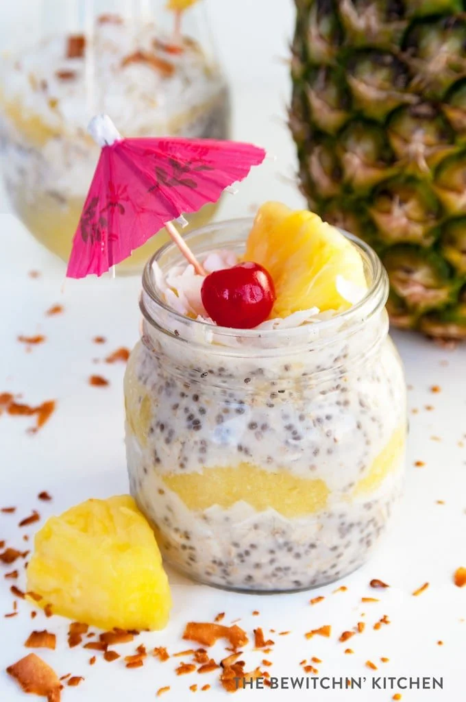 Pina Colada Overnight Oats served in a bowl with fresh coconut and pineapple.
