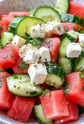 Fresh watermelon cucumber feta salad served in a bowl