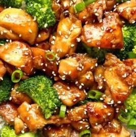 Teriyaki chicken rice bowls with vegetables and sesame seeds in a bowl
