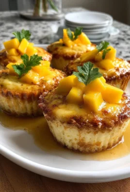 Thai Mango Sticky Rice Cups garnished with coconut and mango slices