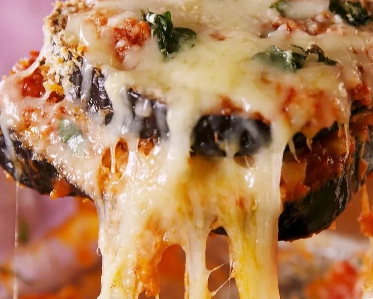Deliciously baked eggplant parmesan with layers of cheesy goodness and marinara sauce