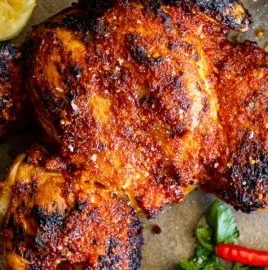 Delicious baked peri peri chicken with spicy seasoning and herbs