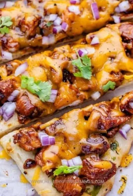 Delicious BBQ chicken naan pizza topped with cheese and fresh cilantro