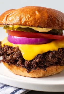 Delicious cheesy smash burgers served with melted cheese and fresh toppings