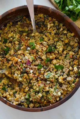 Delicious Corn on the Cob Pasta Salad with fresh vegetables and dressing