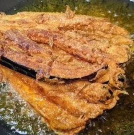 Deliciously crispy fried eggplant slices served as a savory appetizer.