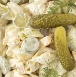 Delicious Dill Pickle Pasta Salad in a bowl with fresh ingredients