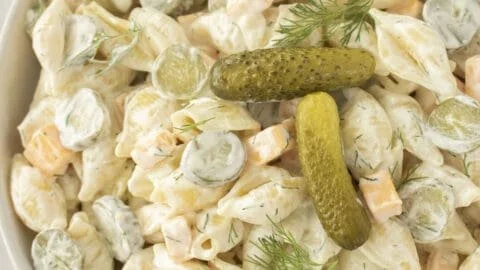 Delicious Dill Pickle Pasta Salad in a bowl with fresh ingredients