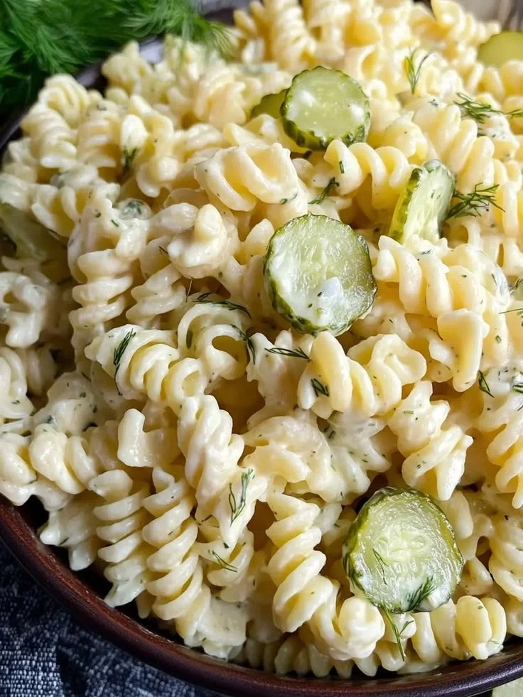 Delicious Dill Pickle Pasta Salad served in a bowl with fresh ingredients.