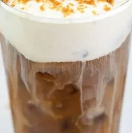 Dunkin's Cookie Butter Cold Brew with whipped cream and cookie crumbs on top