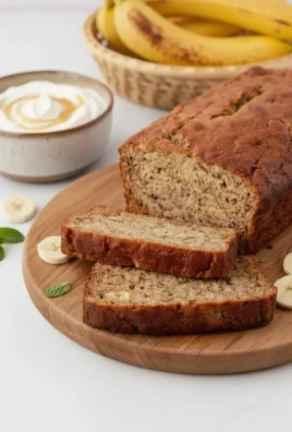 Delicious slice of Greek yogurt banana bread on a wooden table