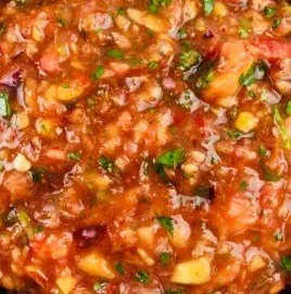 Fresh jalapeno peach salsa served in a bowl, showcasing vibrant colors and textures.