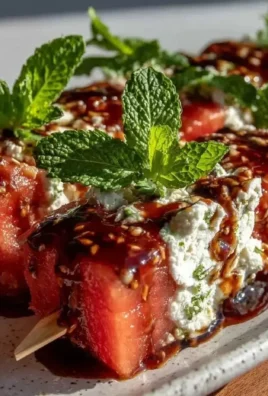 Fresh watermelon feta skewers topped with mint and balsamic glaze