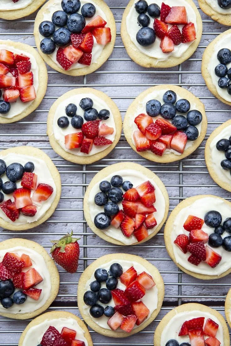 Colorful fruit pizzas topped with fresh fruits and creamy frosting