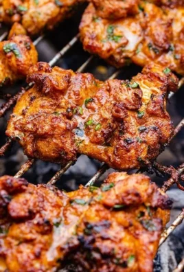 Delicious grilled boneless chicken thighs on the barbecue grill.