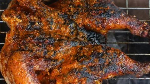 Juicy Grilled Piri Piri Chicken garnished with fresh herbs