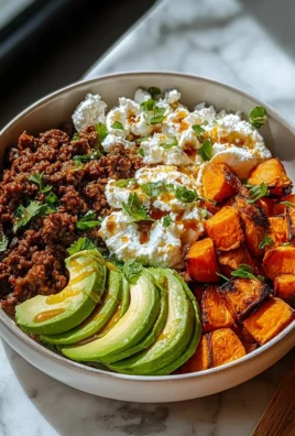 Ground Beef Hot Honey Bowl topped with spicy honey drizzle and fresh herbs