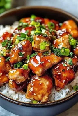 Delicious Hot Honey Chicken Bowl topped with colorful vegetables