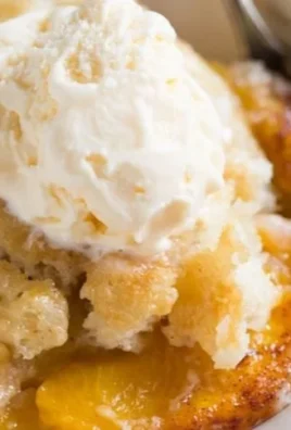 Delicious old fashioned peach cobbler with golden crust and fresh peaches